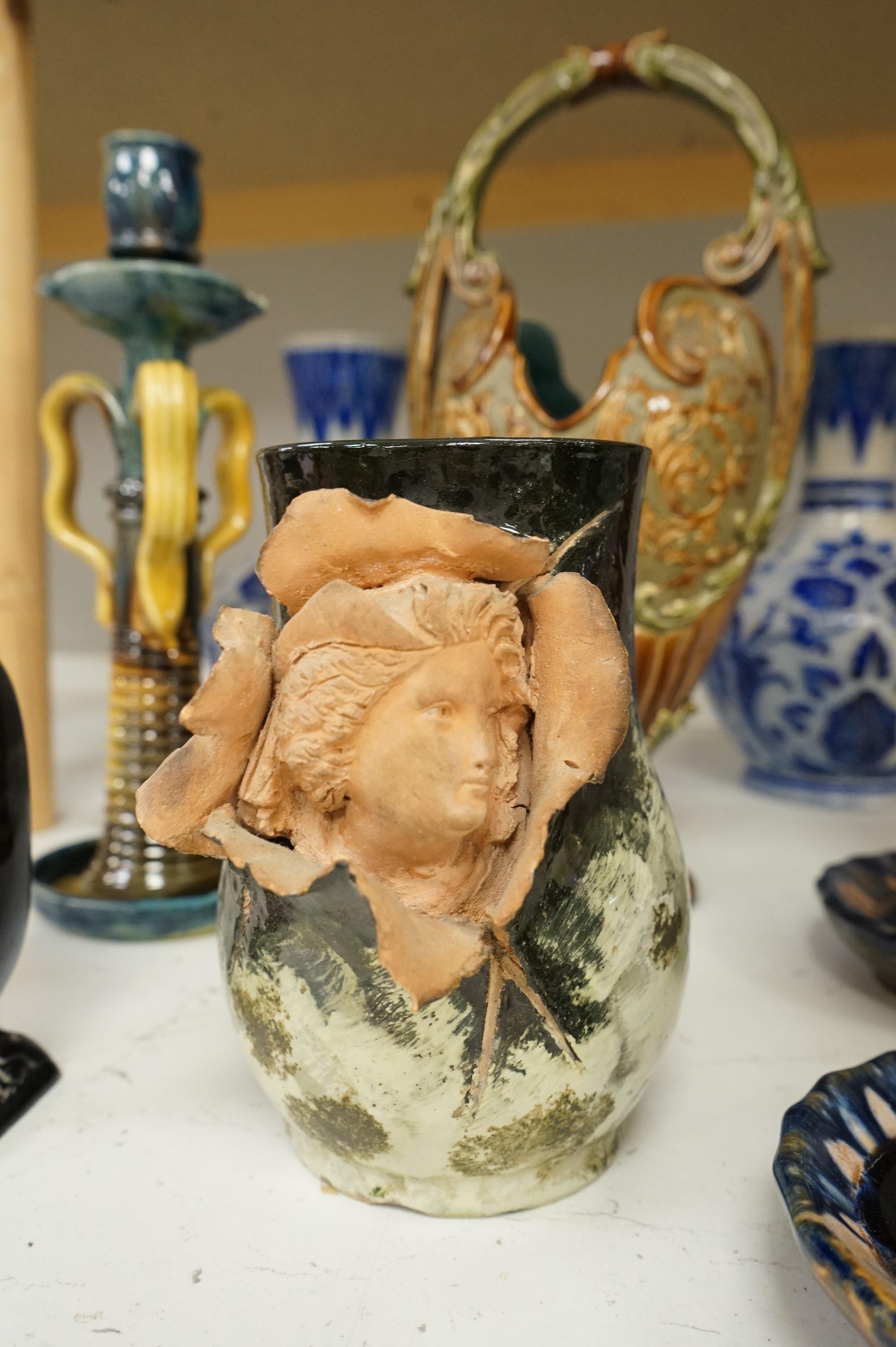 A collection of late 19th century and early 20th century European pottery and stoneware items to include a pair of glazed candlesticks stamped Belgium, largest 36cm high
